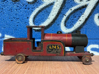 LMS RED, BLACK AND YELLOW WOODEN TRAIN.