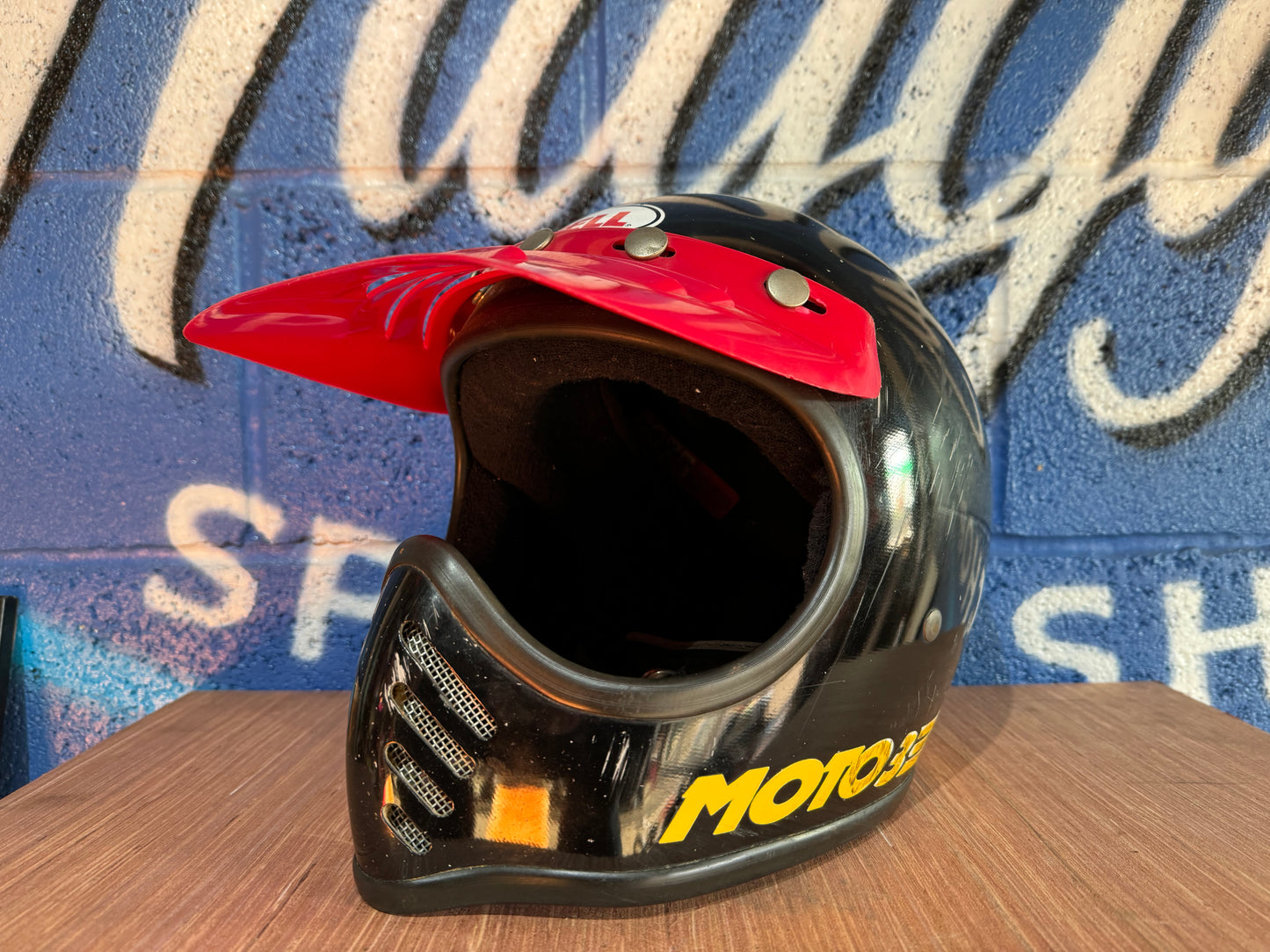 VINTAGE USED LARGE MOTOCROSS MOTO3 BLACK AND RED HELMET