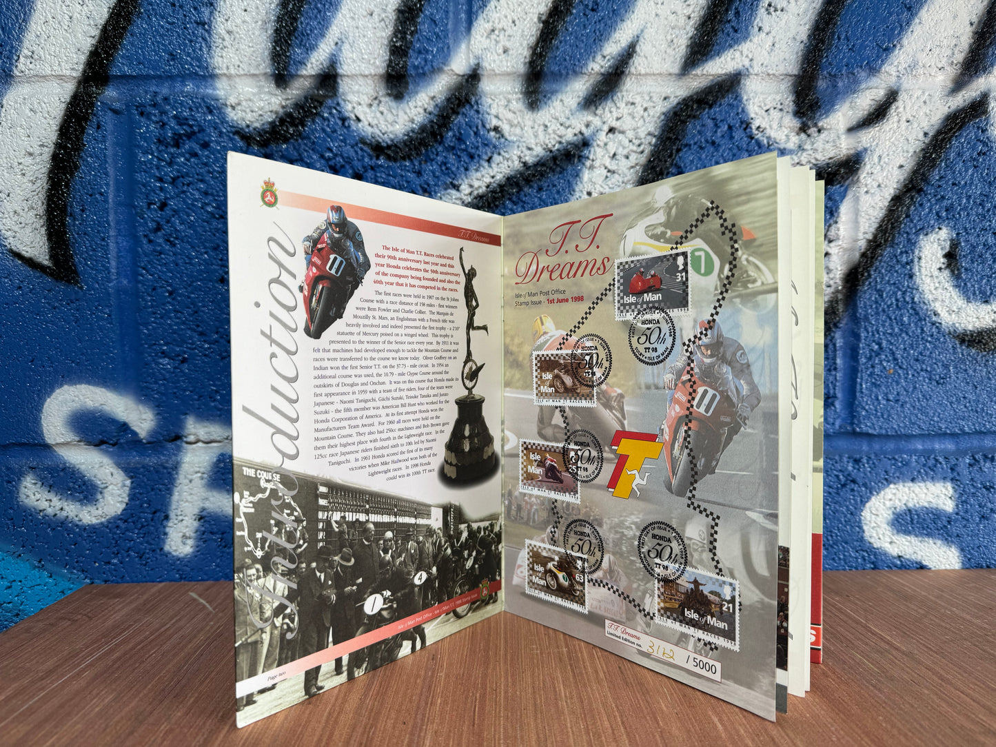 VINTAGE LIMITED TT DREAMS HONDA 50TH ANNIVERSARY BOOK WITH COIN AND STAMPS.