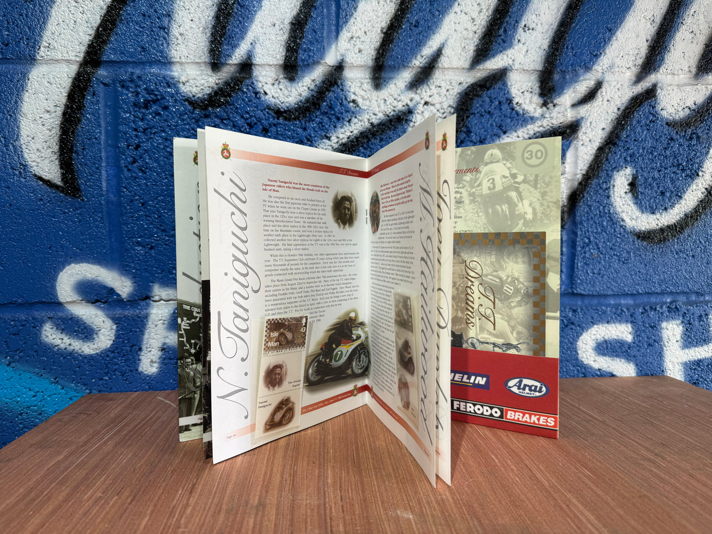 VINTAGE LIMITED TT DREAMS HONDA 50TH ANNIVERSARY BOOK WITH COIN AND STAMPS.