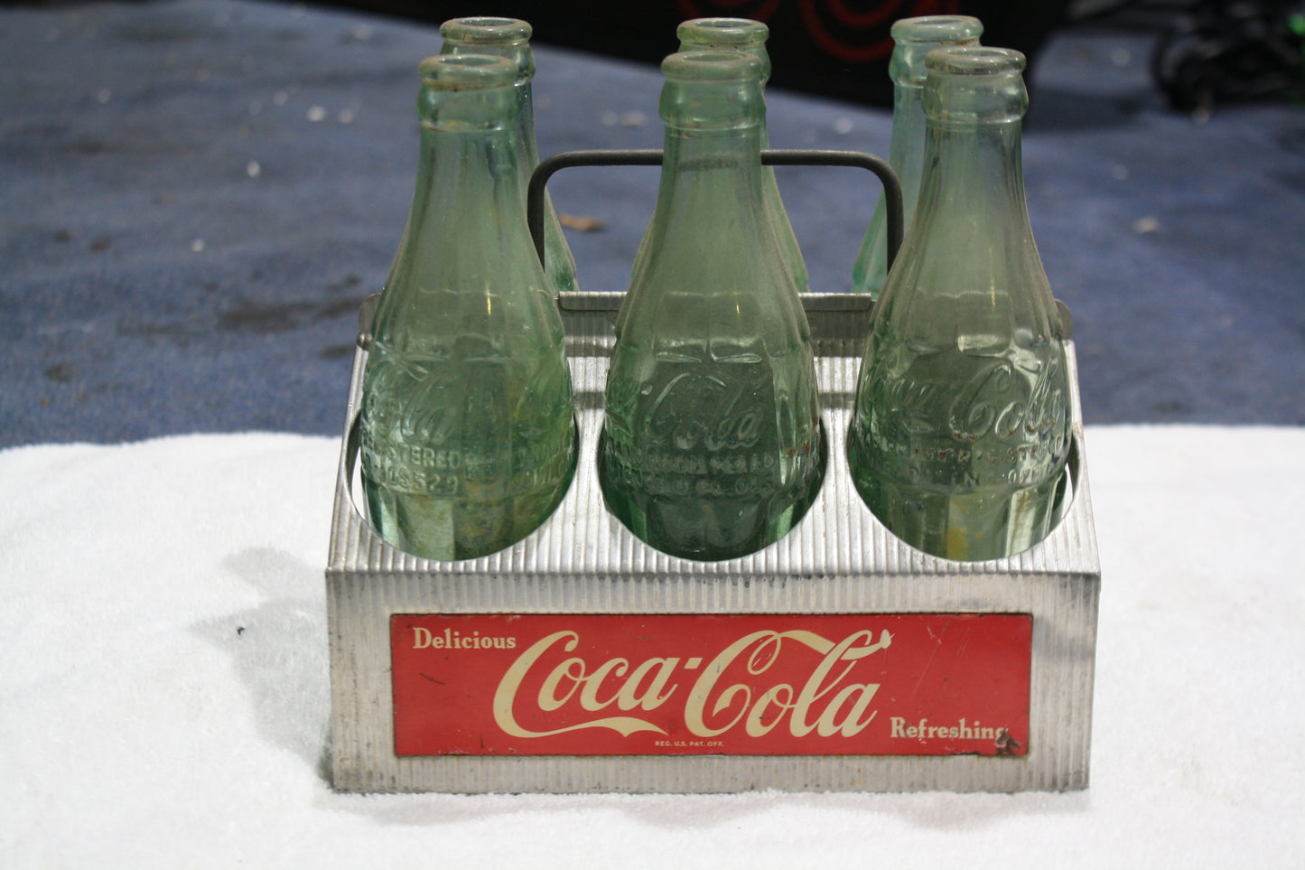 VINTAGE COCA-COLA RED METAL CARRIER AND BOTTLES