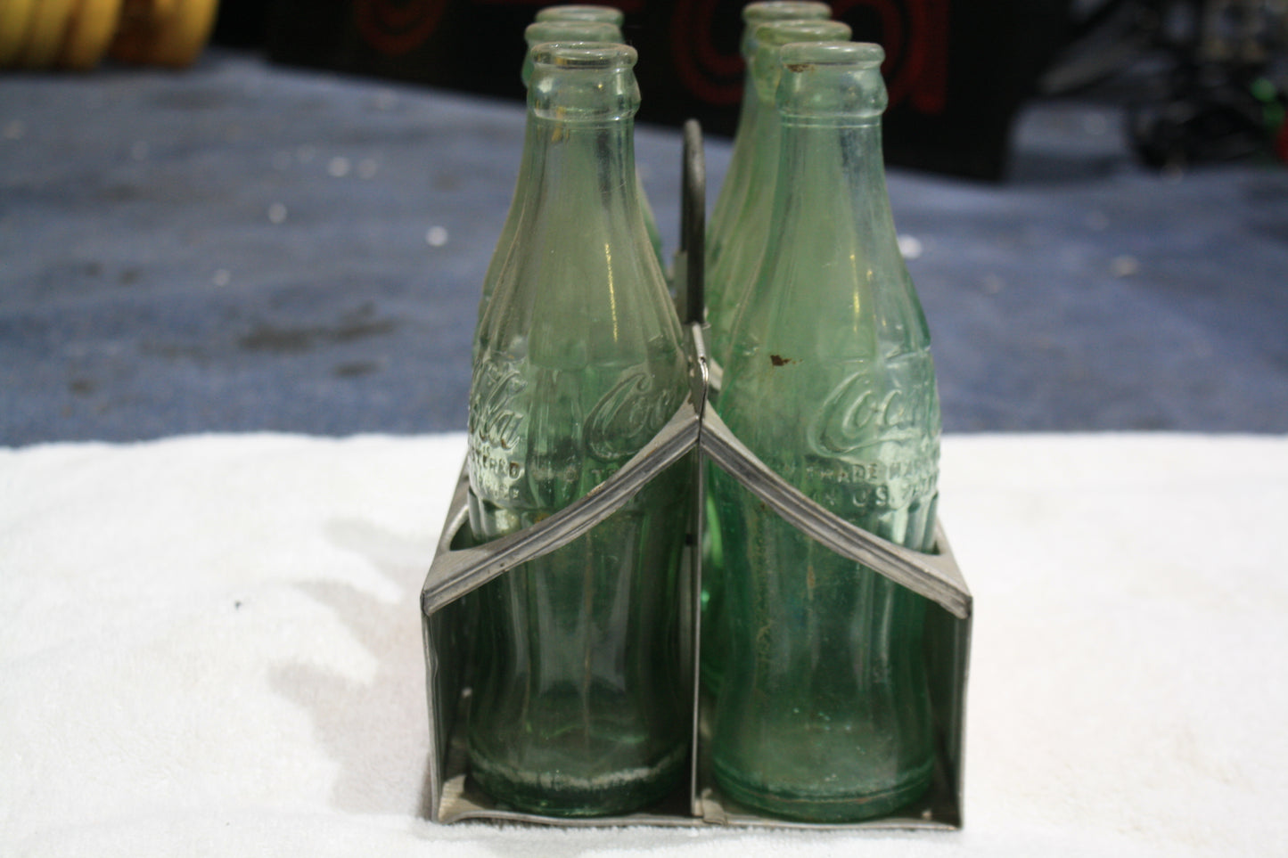 VINTAGE COCA-COLA RED METAL CARRIER AND BOTTLES