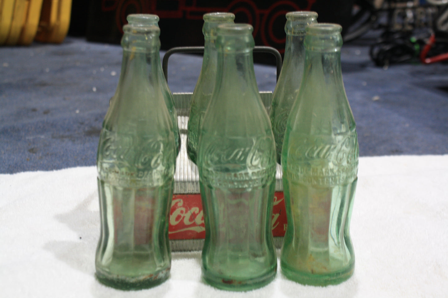 VINTAGE COCA-COLA RED METAL CARRIER AND BOTTLES